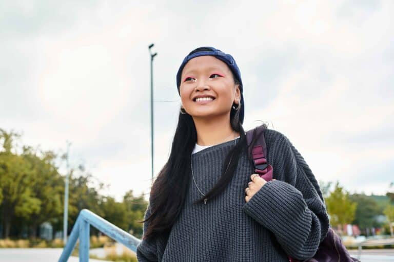 stylish-young-asian-student-smiles-during-a-walk-o-2026-03-12-22-45-01-utc